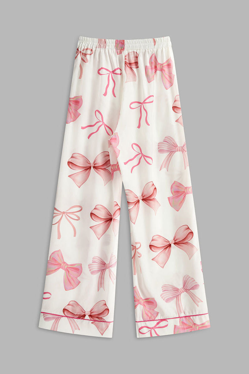 Conjunto de pantalones con botones y estampado de lazo