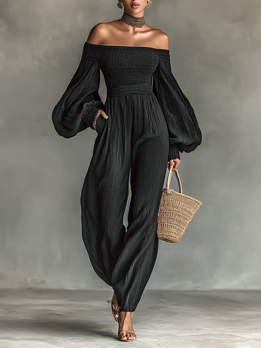 Dame jumpsuit med lange ermer, plissért stoff og av skuldrene design